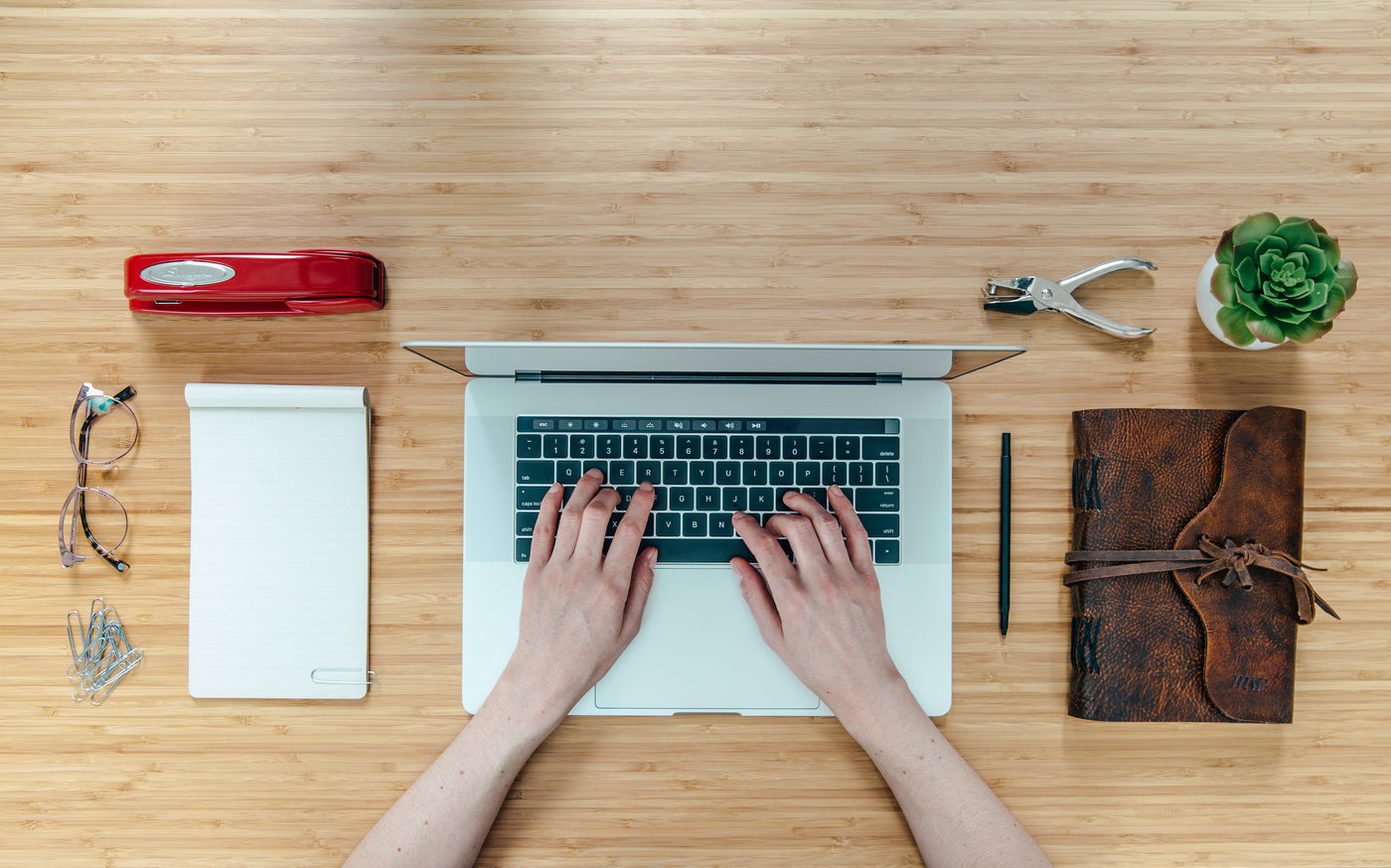A calm desk workspace with a grounding mat under the desk