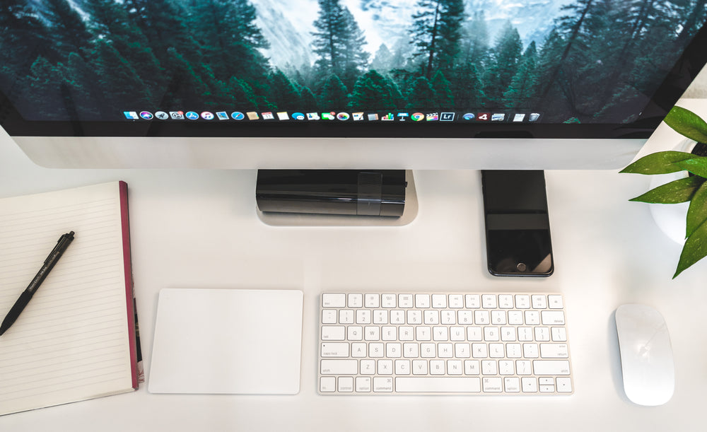 Black grounding mat on a desk surface